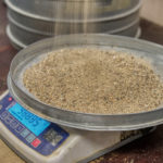 Sand tray on a laboratory balance. Testing laboratory of building materials.